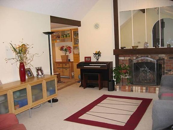 Living room feature vaulted ceilings and now features hardwo