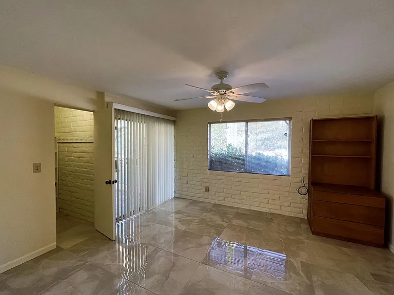 Front middle bedroom, and large walk-in closet, also access to private front patio.