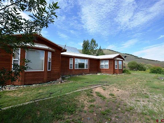 Seclusion on Tomichi Creek with views of Parlin valley and mountain views.