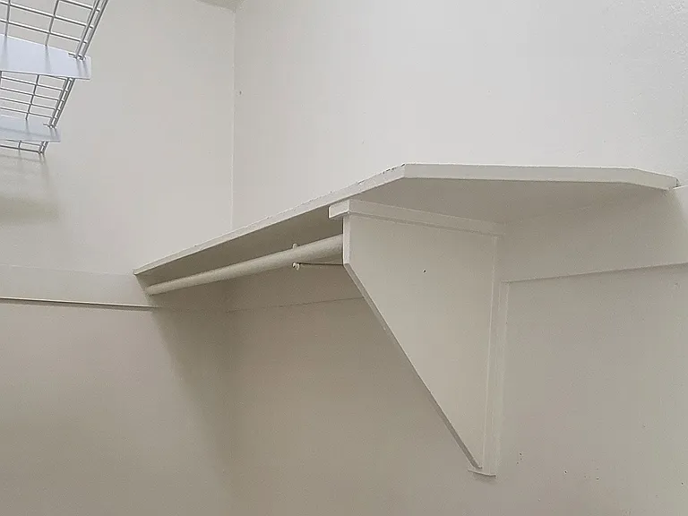 Shelves and built in chest in large closet at the Western At Rosewood apartments in Los Angeles, California.