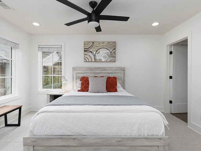 Bedroom 2 with a king bed and ensuite bath. Located on the 1st floor. Tastefully decorated with high-end modern furnishings and thoughtful touches to make your stay as comfortable as possible.