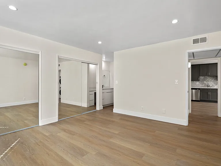 Large Size Bedroom with Double Mirrored Closet and Full-Size Bathroom