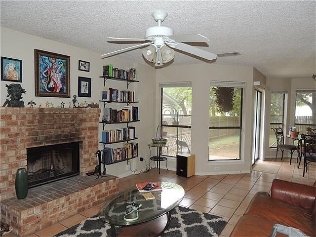 Another view of family room. This is such a cute floor plan. Nice easy care tile floors.