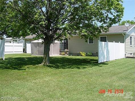 Large fenced in patio area in back yard.