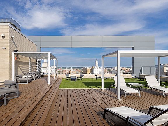 Wooded rooftop deck and chaise loungers to soak in the view