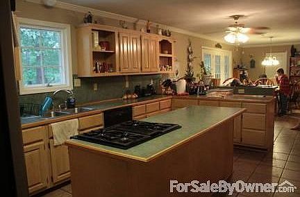 Kitchen with island and lots of custom cabinet space