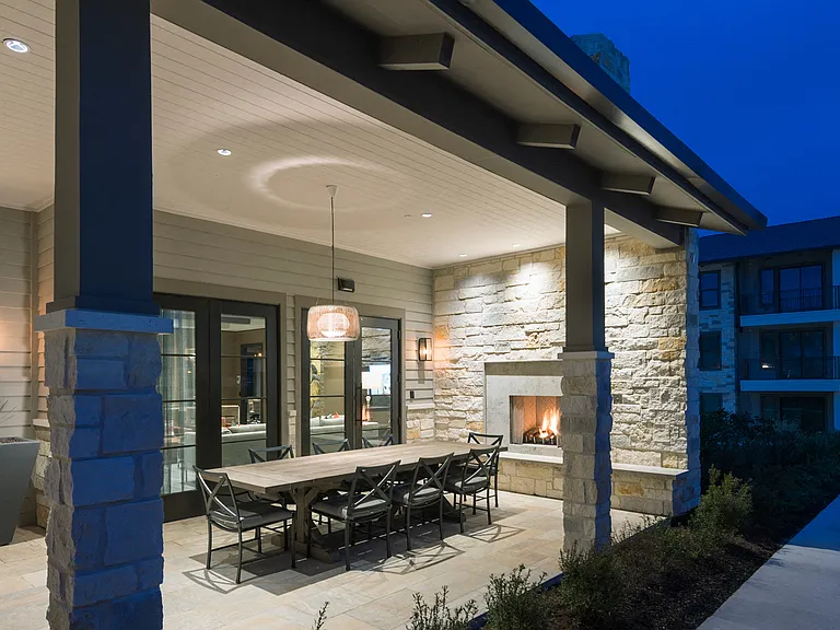 Open-air dining porch with fireplace