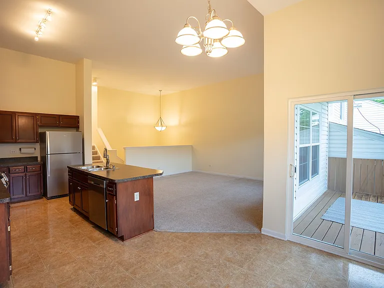 Dining area, kitchen, great room and balcony off dining area