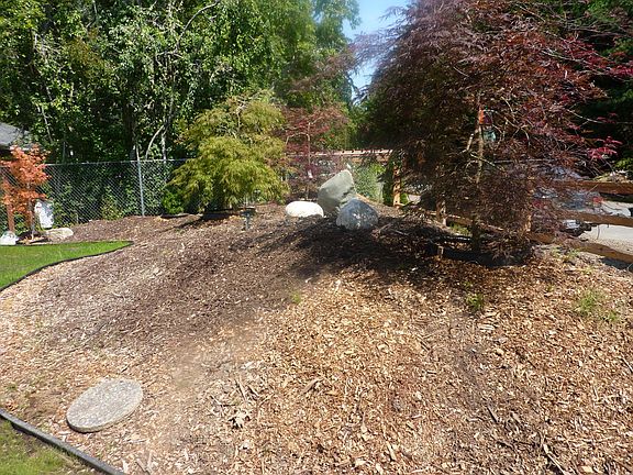 Front yard berm provides privacy.