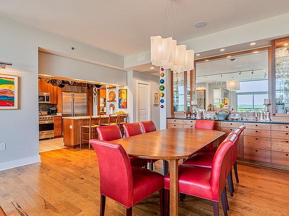 Large dining area with custom built in buffet. Murano glass chandelier.