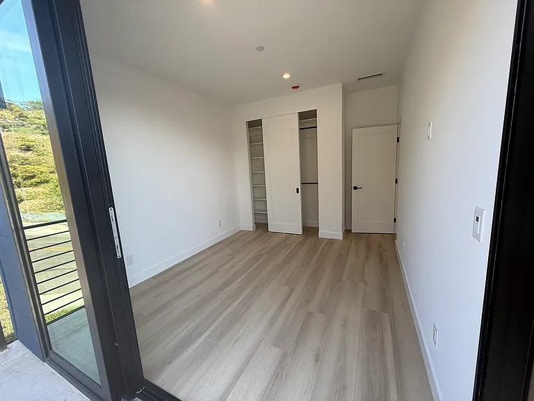 Upstairs bedroom 2 with shared balcony
