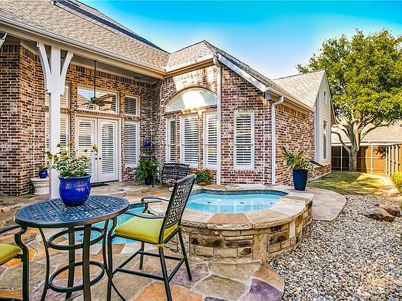 Gorgeous backyard with raised spa and plunge pool.  There is also some grassy area for your pet.