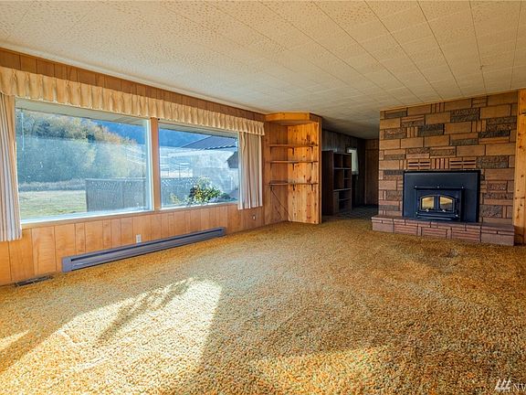 Large picture windows in the great room provide sweeping views of Mount Peoh which seems like it is just across the street!  A wood stove insert provides supplemental heat to the forced air furnace.