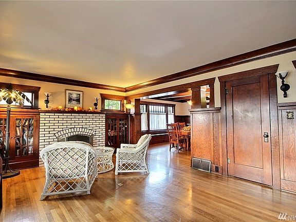 Swing open the doors to find open space and gorgeous original woodwork.