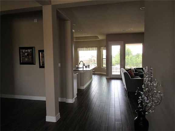 From entryway looking straight back into kitchen and back out onto patio