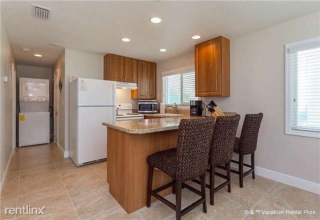 A dining table and a breakfast bar