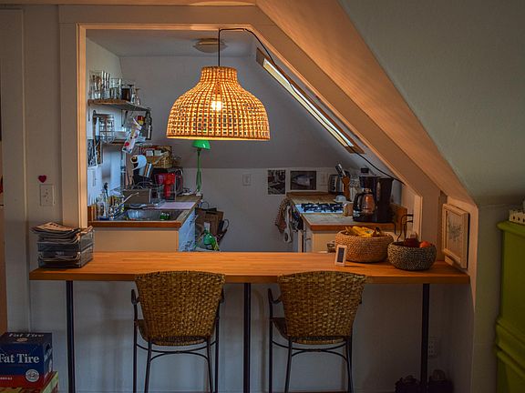 Kitchen and eat-in bar with butcher block counters