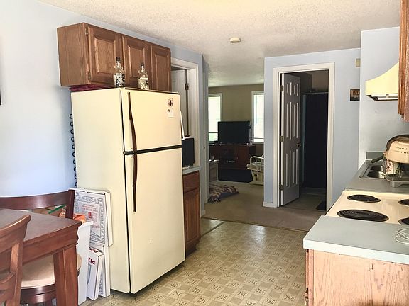 Kitchen now has updated black appliances.