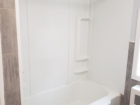 Bathtub and shower included