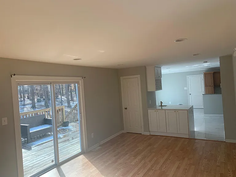 Family room showing Wet Bar and Kitchen.