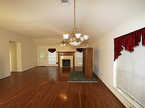 Living/dining area as seen from kitchen bar.