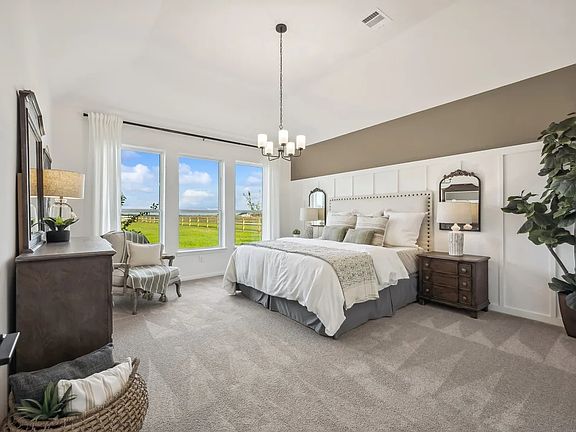 Primary suite with sloped ceiling