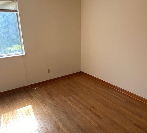 second bedroom, also upstairs with closet and hardwood