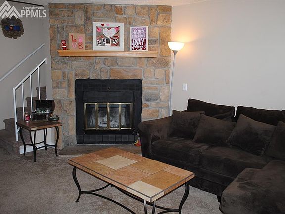 Wood fireplace with stone surround
