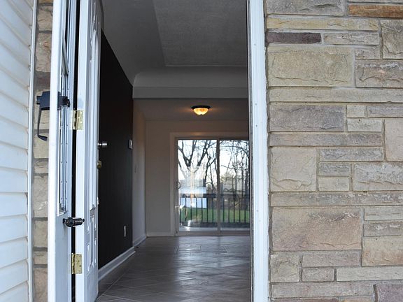 Front entrance peeking at the deck