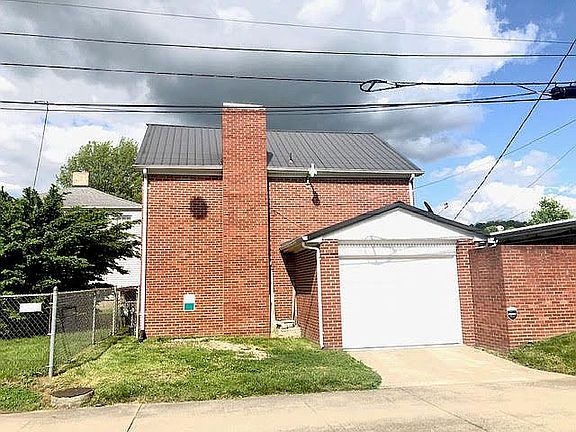 Rear of home with garage