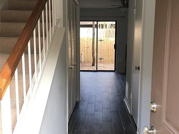 ENTRY with Entrance to Kitchen on Right, 1/2 bath on right beyond and Laundry on LEFT under the stairs as you walk into the LARGE FAMILY ROOM.