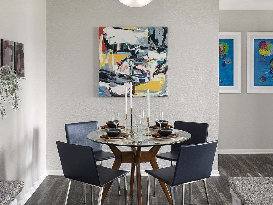 Apartment Dining room with wood floors.