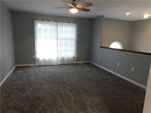 Carpet & Ceiling Fans Throughout