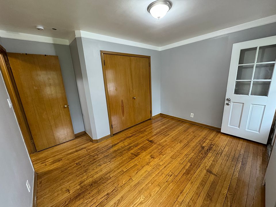 Bedroom 1 with entry/exit into parking lot.