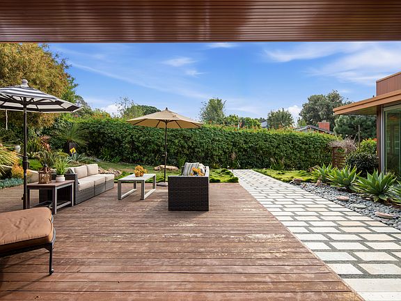 View from inside the home with panoramic door that open to the courtyard.