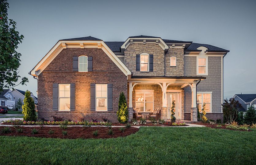 Worthington Exterior 6 featuring stone, brick, shakes and covered front porch
