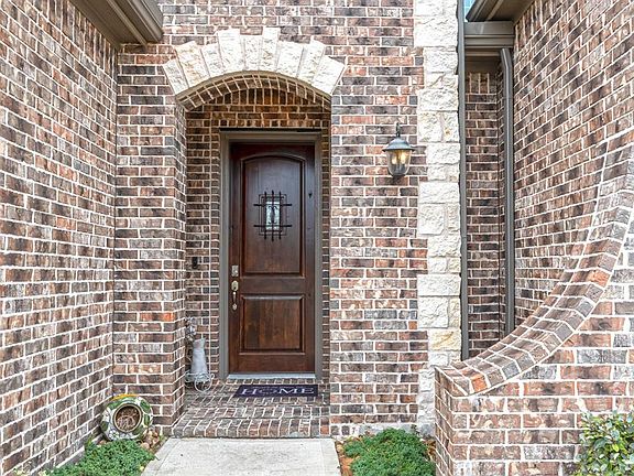 As you approach this multifaceted covered porch you are greeted by an 8' Portobello solid mahogany front door with a decorative wrought iron covered speakeasy. What a bonus that the ring doorbell and keyless entry stay with the home.