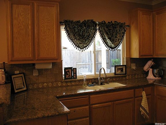 Another kitchen view the window overlooks the patio and backyard.