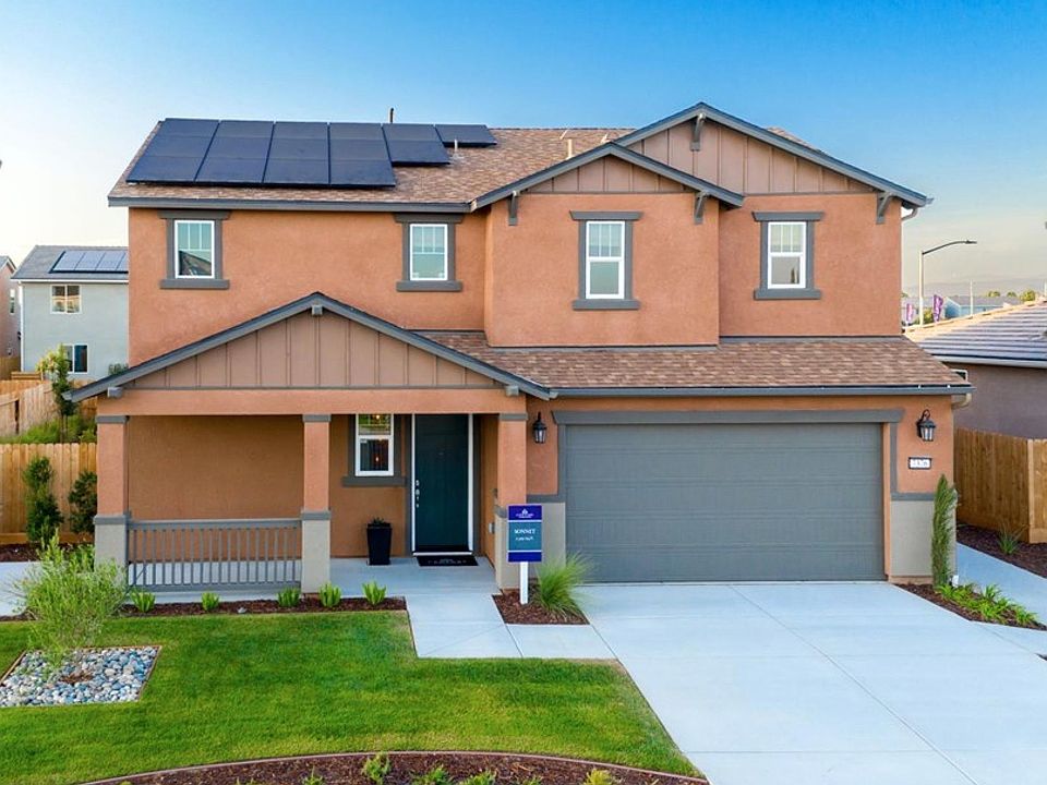 Model home front view with beautifully landscaped