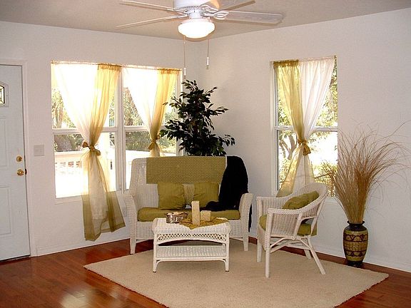 Light and bright living room space with shiny hardwood floors