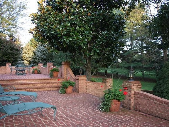 Multi-level Brick Terrace with arched walls, curved walkways and lighting