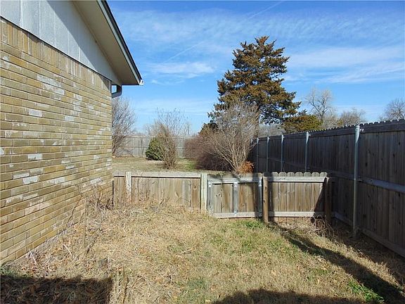 The east side of the house has a small separate gated area.  This could be used for a pet, a child's play area or a garden area.