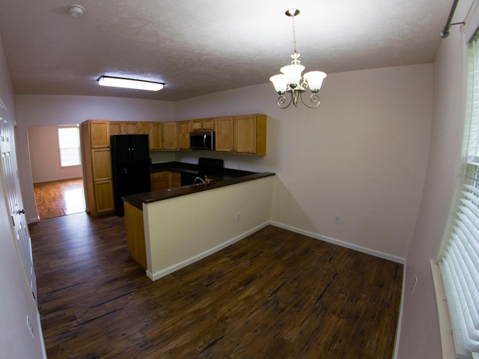 Panoramic view of Kitchen/Dining area leading to Living Room