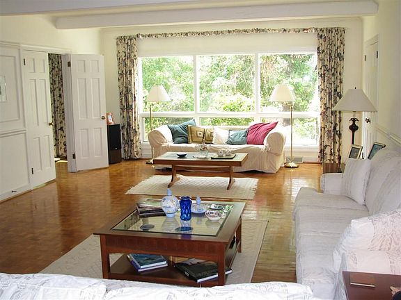 Living Room with Beam Ceiling
