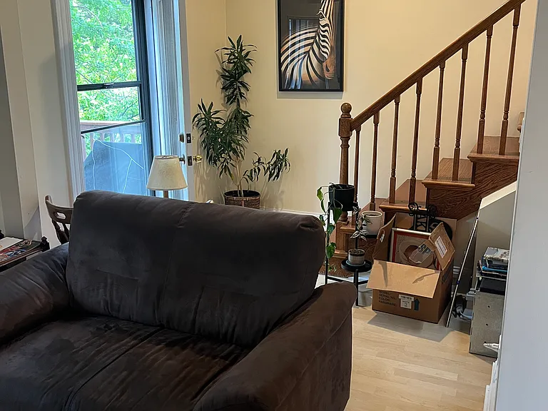 Living room - the other part wraps around to the door to the front balcony and to the custom oak staircase that leads to the 3rd floor bedrooms