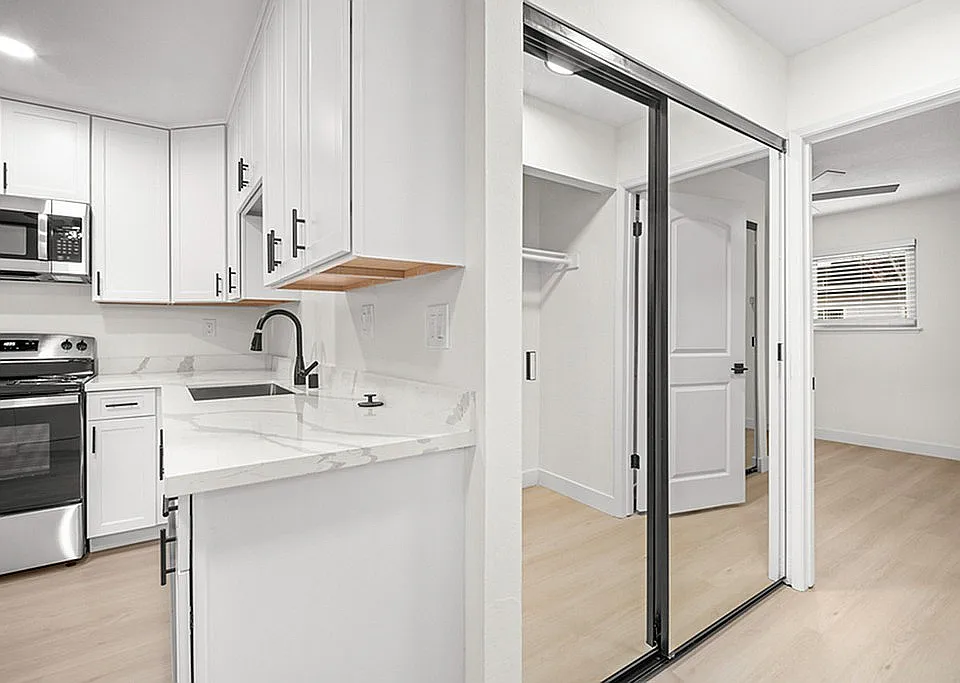 Mirrored closet doors in the hallway help open up and brighten the space.