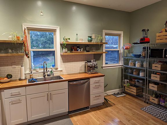 Metal shelving racks for additional storage included. You may also utilize the wood storage bins if desired (just let us know).