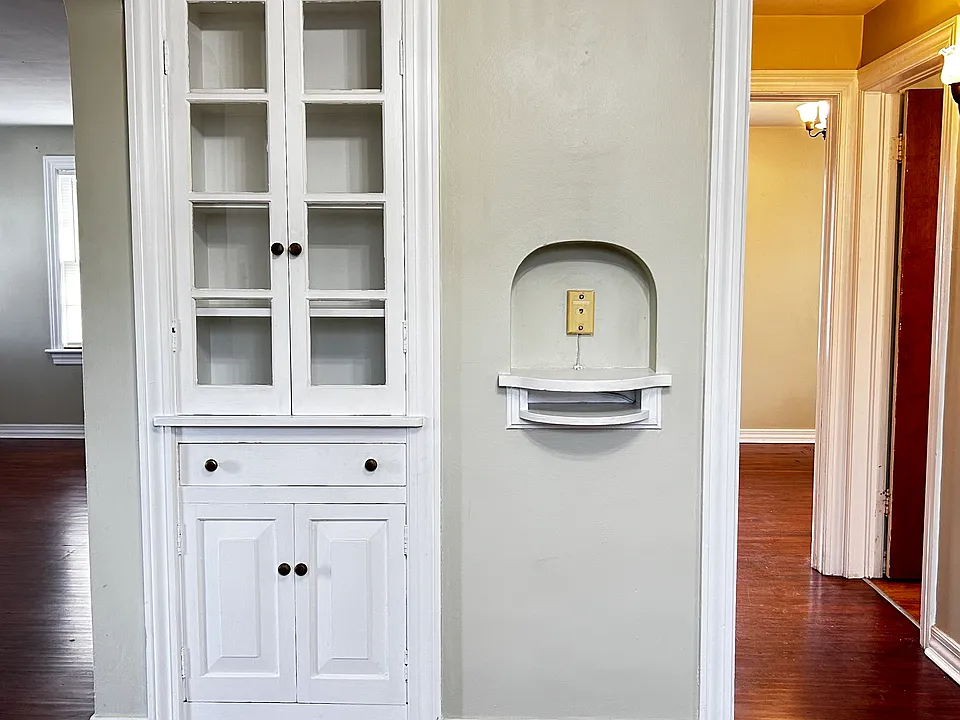 Built-ins in Dining Room. Hallway on right leads to bathroom, bedroom and two hall closets. Room on the left is the living room.