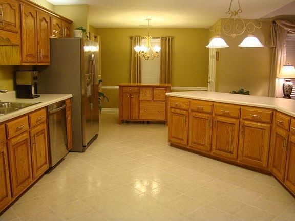 Large kitchen with new Whirlpool Gold appliances.