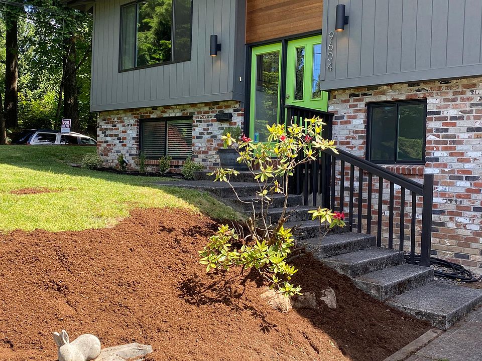 Front entry from driveway with parking for 2 cars in front of garage